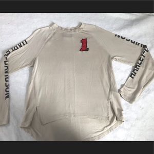 Sporty HD cream knit size medium pullover shirt. Racing look with #1 stitching